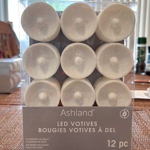 One 12 pc pack of white glitter led votives